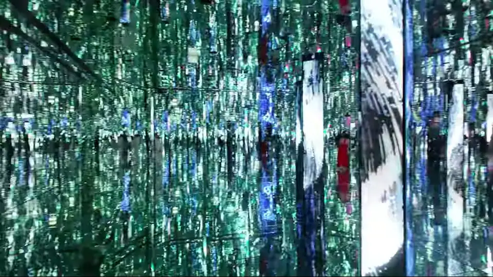 Mirrored light room recedes with a small figure in red.