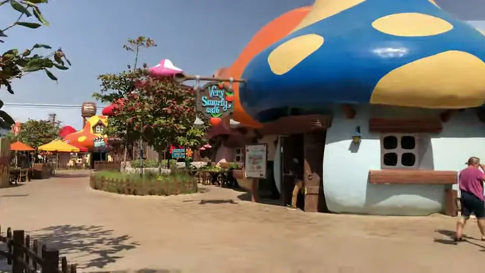 Very Smurfy Cafe with mushroom roof and village walkway.