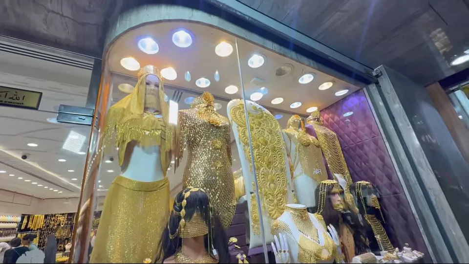 Mannequins in elaborate gold costume jewelry inside Dubai Gold Souk